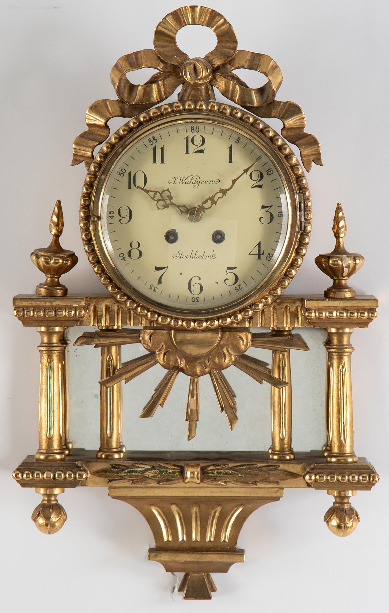 A 20th century gustavian style wall clock.