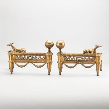 A pair of Louis XVI 18/19 century fire dogs.