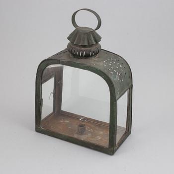 An 18th century tinplate and glass lantern.