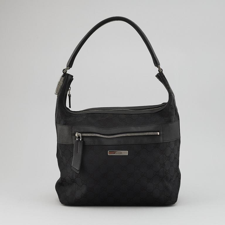 GUCCI, a canvas and leather bag.