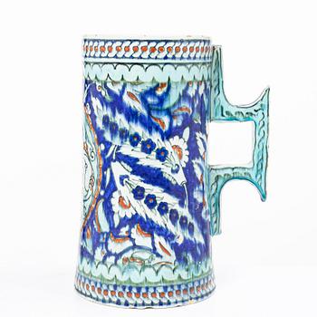 An Iznik style glazed ceramic tankard, probably Europe, 19th century.