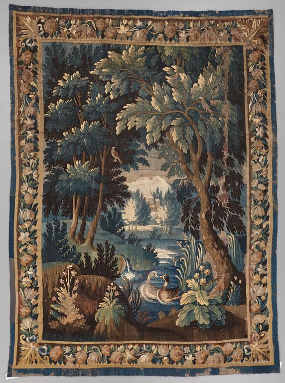 A TAPESTRY, tapestry weave, a "Verdure",  ca 304 x 224,5 cm, Flanders 17th century, signed "W" a lily "B".