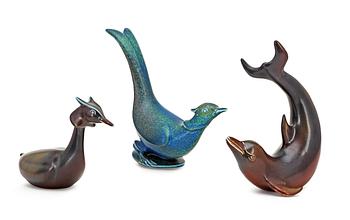 Three Gunnar Nylund stoneware figures, a dolphin, a pheasant and a great crested grebe, Rörstrand.