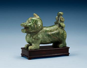 1735. A nephrite figure of a Buddhist Lion, late Qing dynasty.