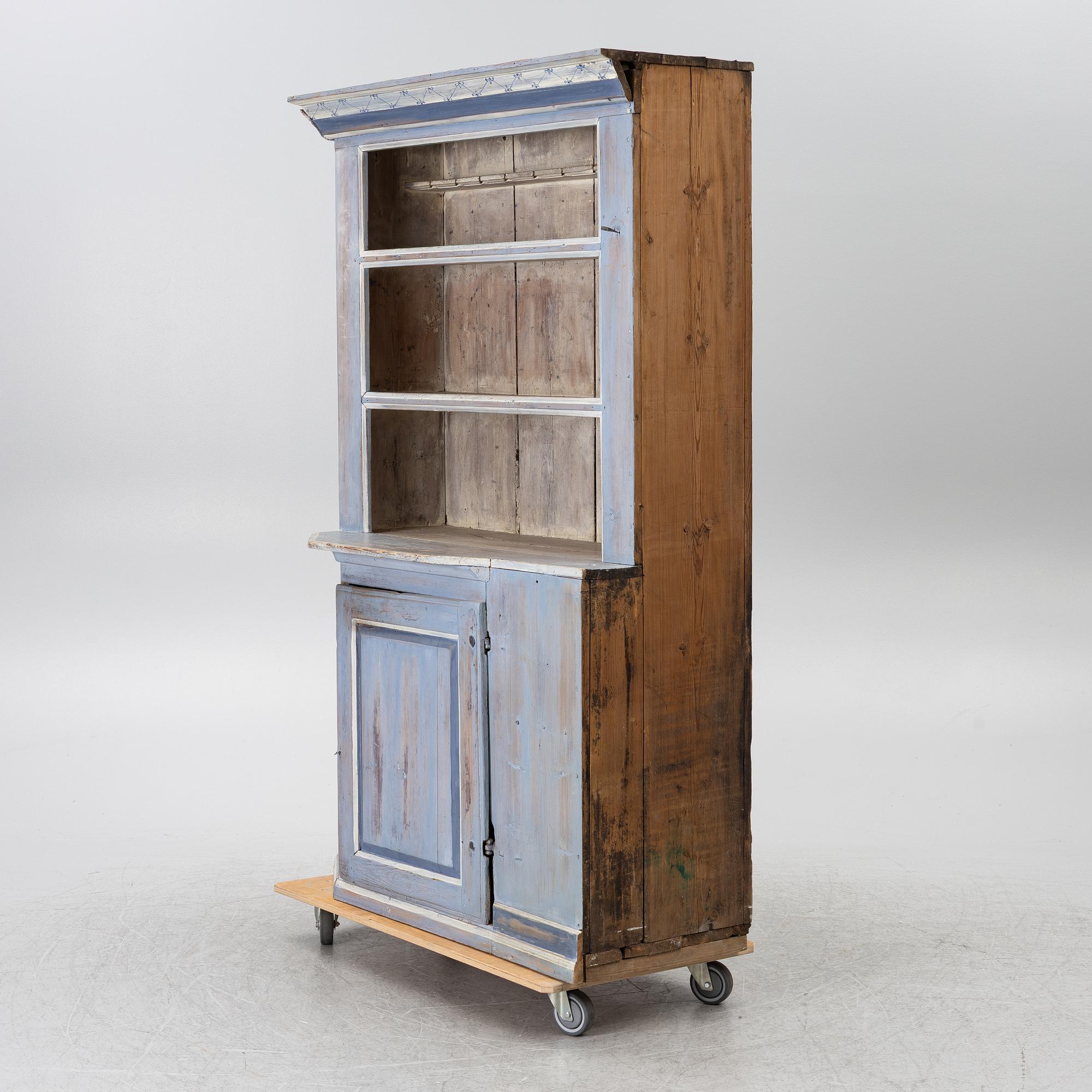 A painted folk-art cupboard, early 19th century.
