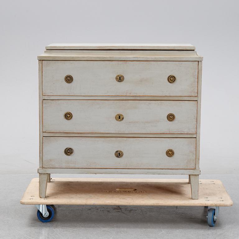 A painted chest of drawers, 19th Century.