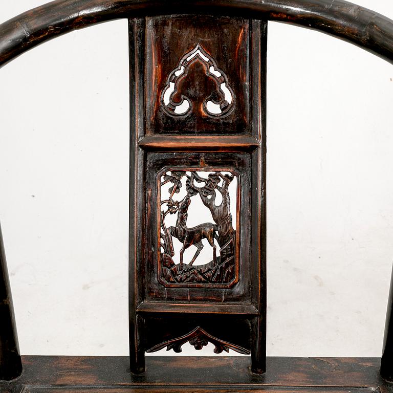 A pair of Chinese hardwood armchairs, circa 1900.