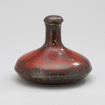 A Hans Hedberg faience bottle with stopper.