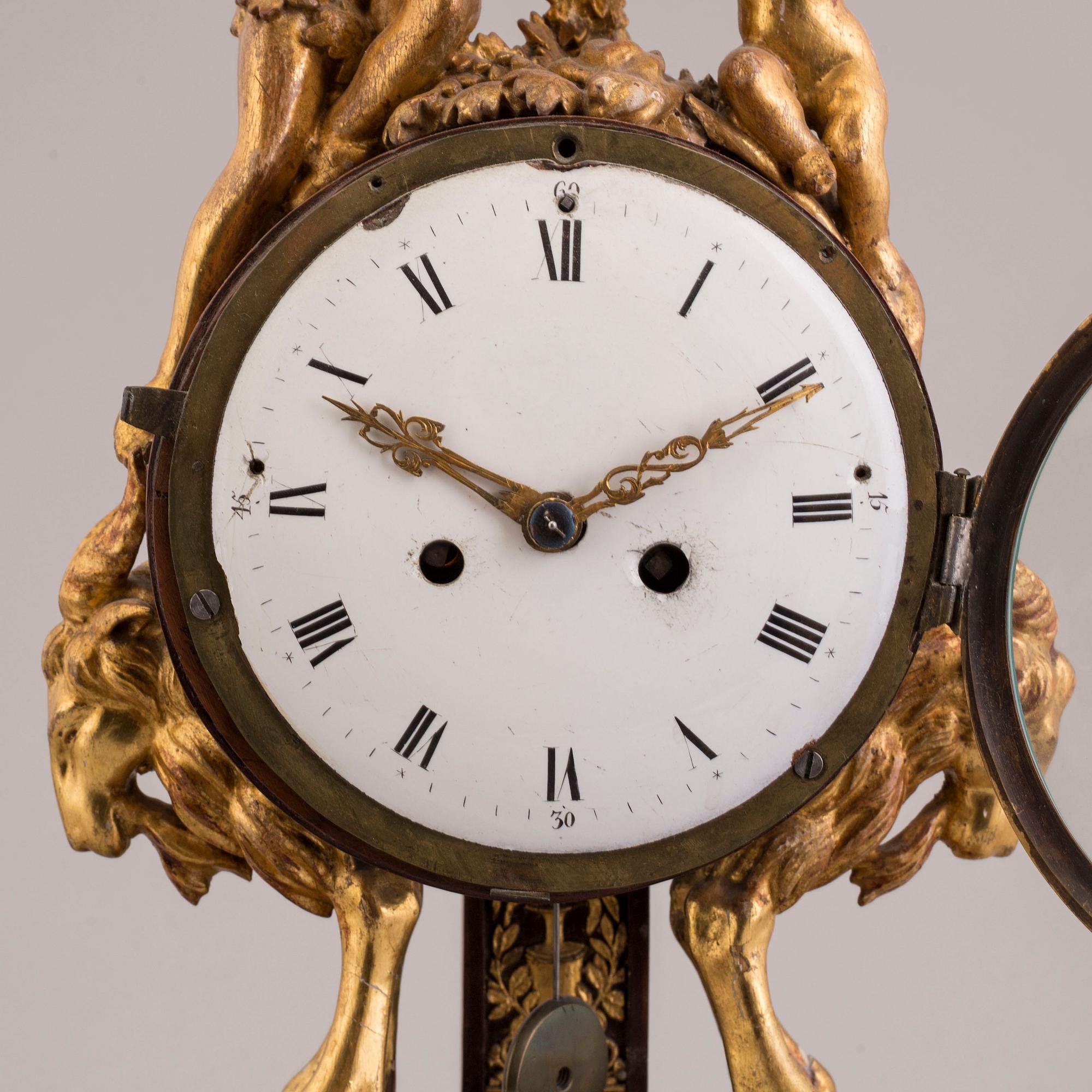 A PENDULUM CLOCK, first half of the 19th century.