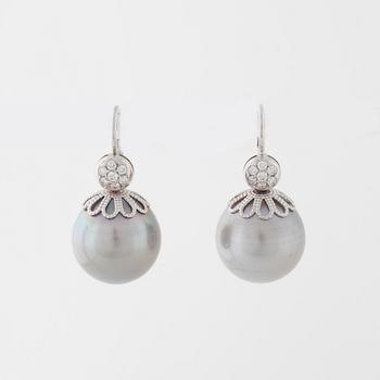 A pair of cultured pearl and brilliant cut diamond earrings.