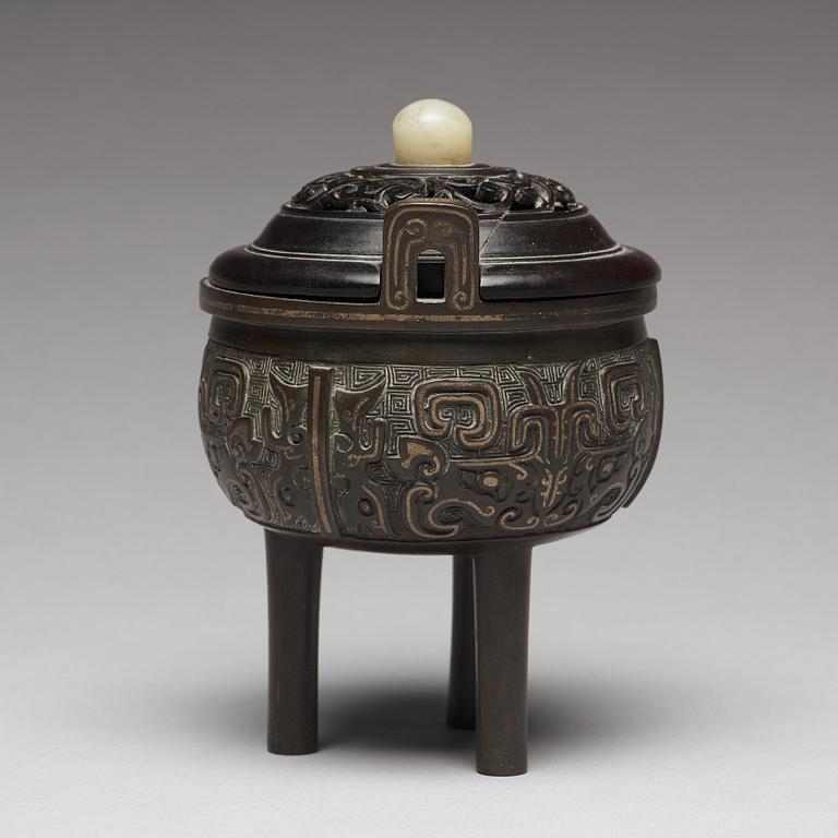 A tripod bronze censer Qing dynasty, 19th Century.