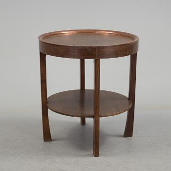 A early 20th century oak table with copper top.