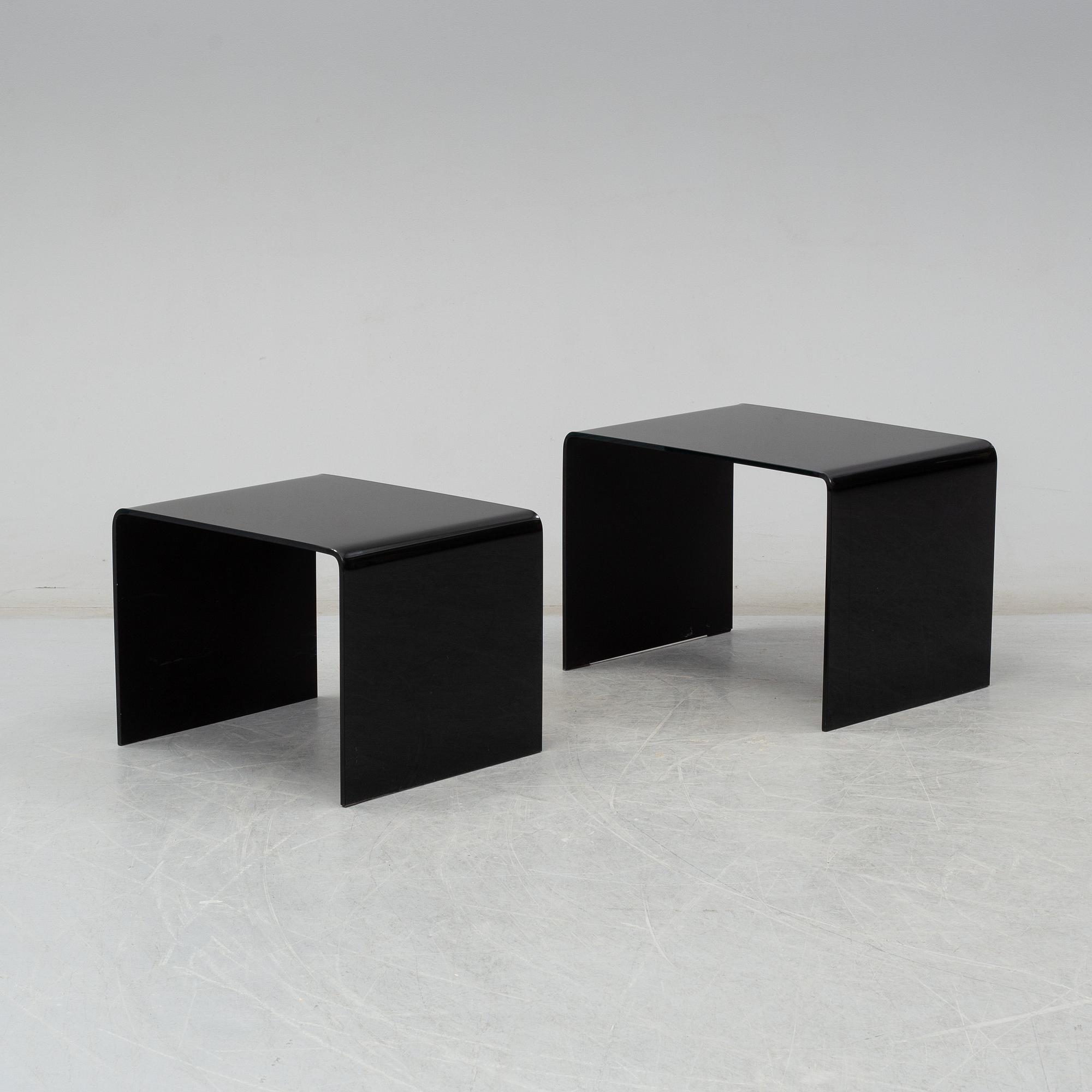 Two modern glass tables.