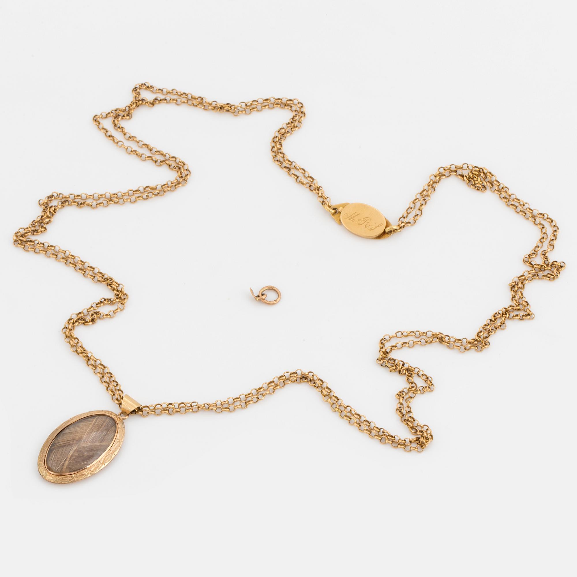A chain and locket with hairwork.