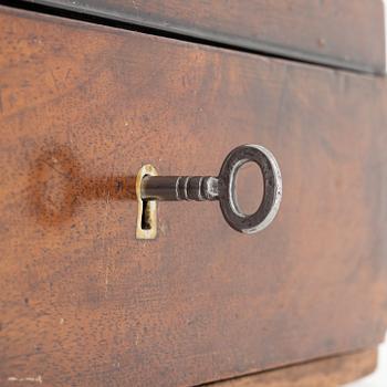 An early 19th century mahogny-veneered box for shaving utensils.