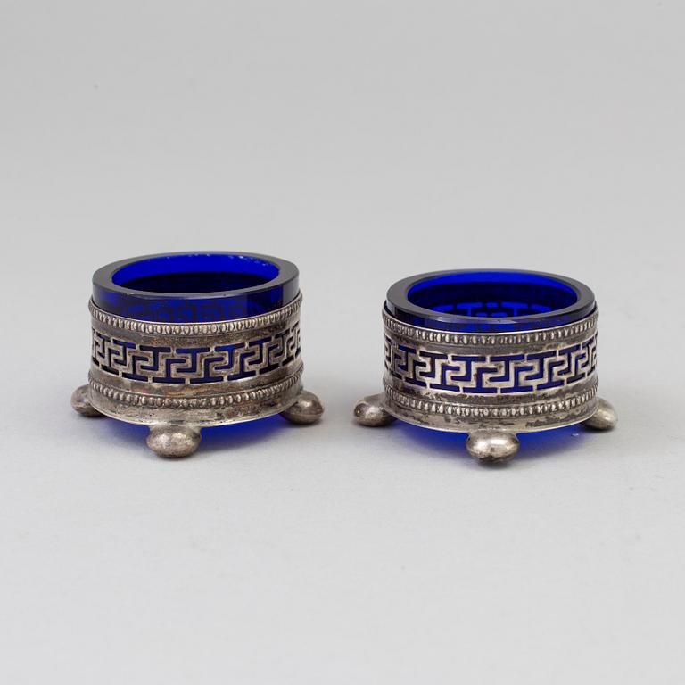 A Pair Of Neoclassical Silver And Glass Salt Cellars, early 20th century.