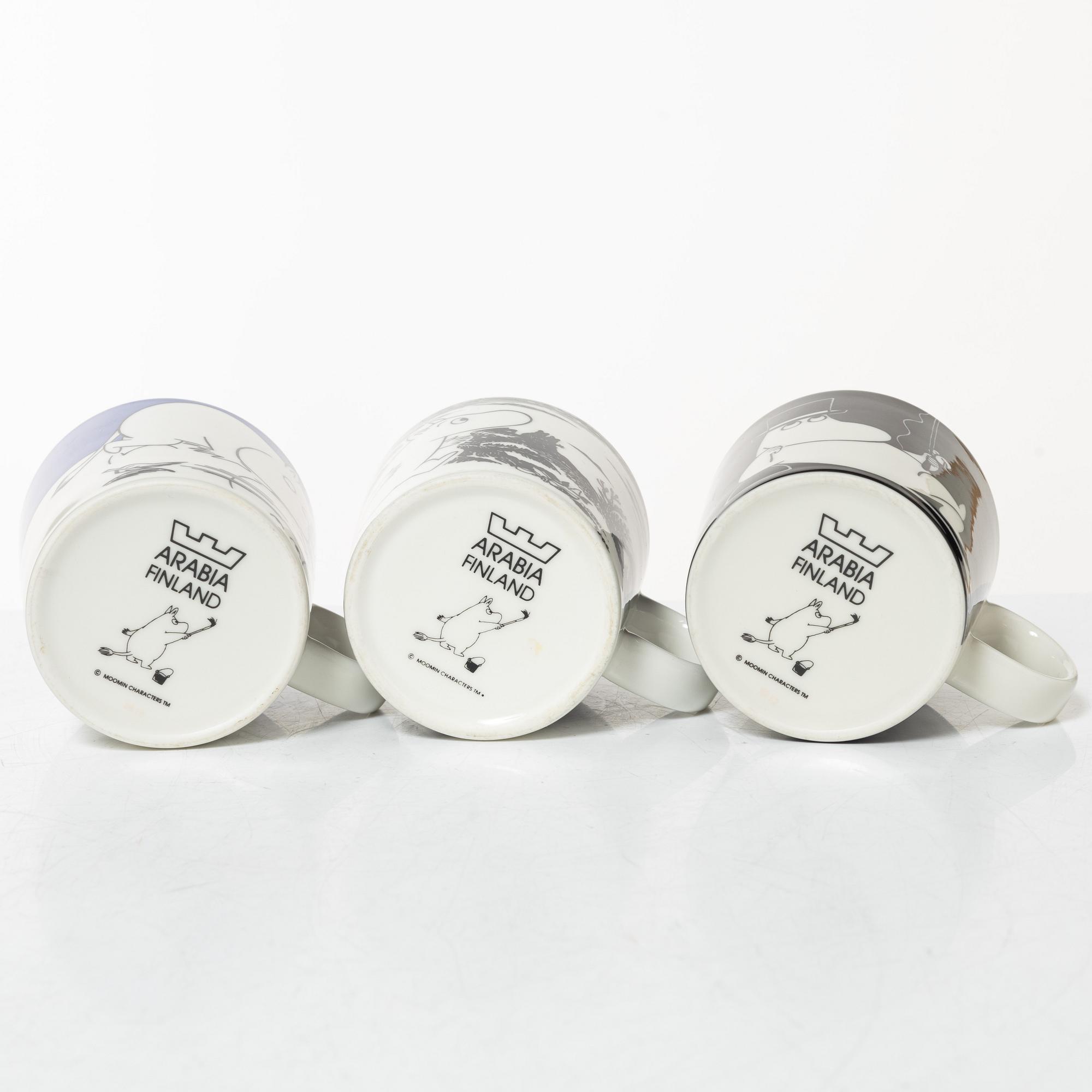 A set of 24 Moomin mugs, Arabia, Finland.