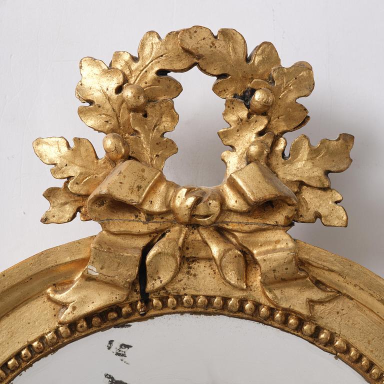 A pair of Gustavian giltwood two-branch girandole mirrors by J. Åkerblad (master in Stockholm 1758-99).