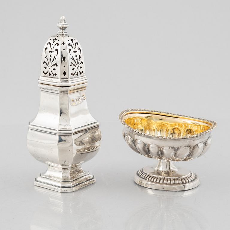 A silver sugar caster from E. S. Barnsley & Co, Birmingham,  1914, and a silver salt cellar with indistinct marks.