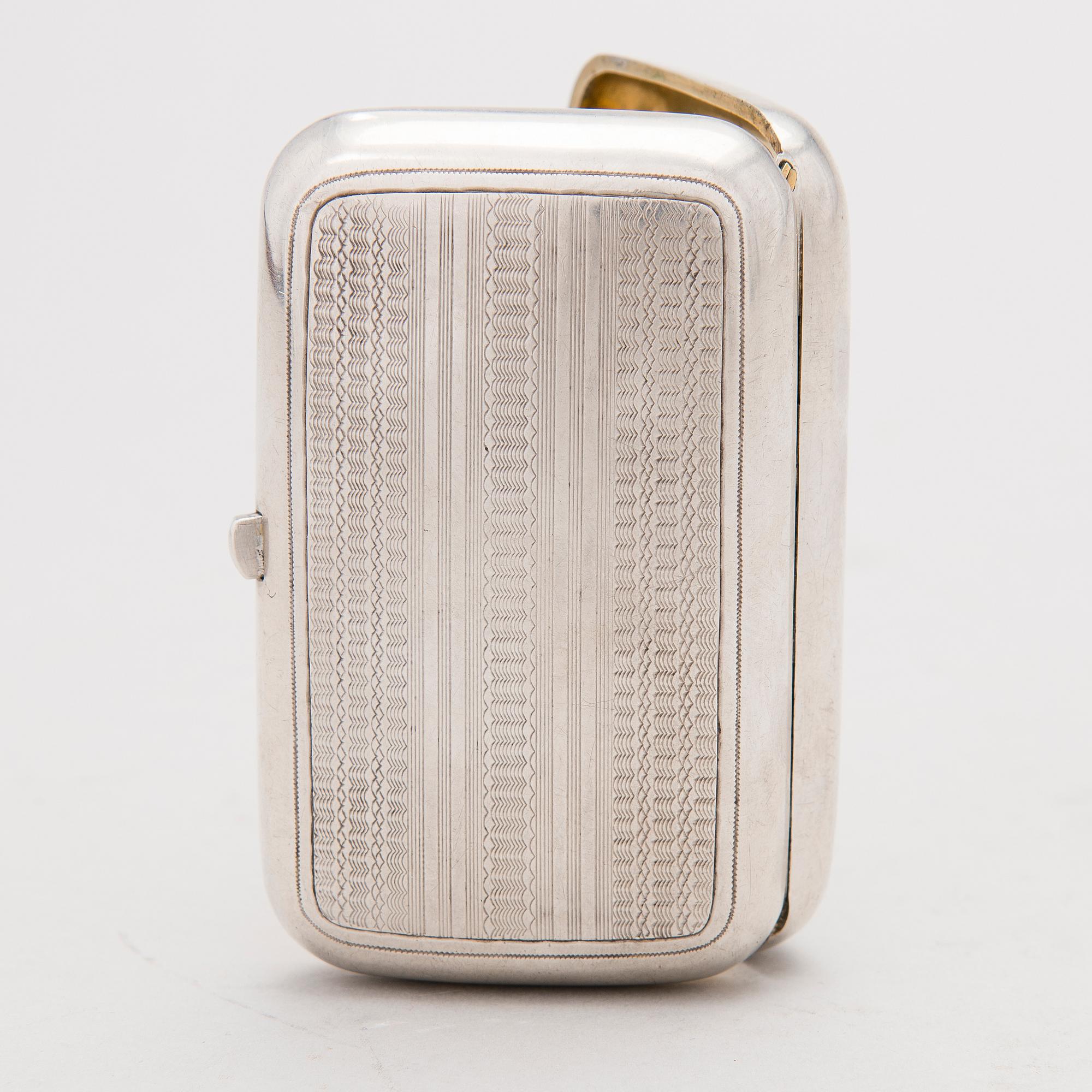 A Russian silver cigarette case, mark of OE, assay master Vasily Aleksandrovich Petrov, Moscow (1883-1893).