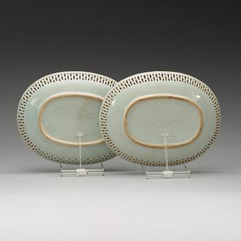 A pair of oval famille rose dishes with figural motifs, Qing dynasty, circa 1800.