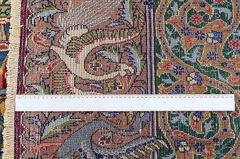 A Kashmar figural carpet. Circa 390 x 300 cm.