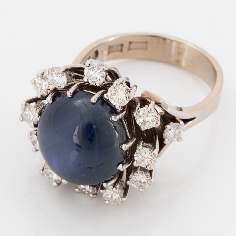 Cabochon-cut sapphire and brilliant-cut diamond cocktail ring.