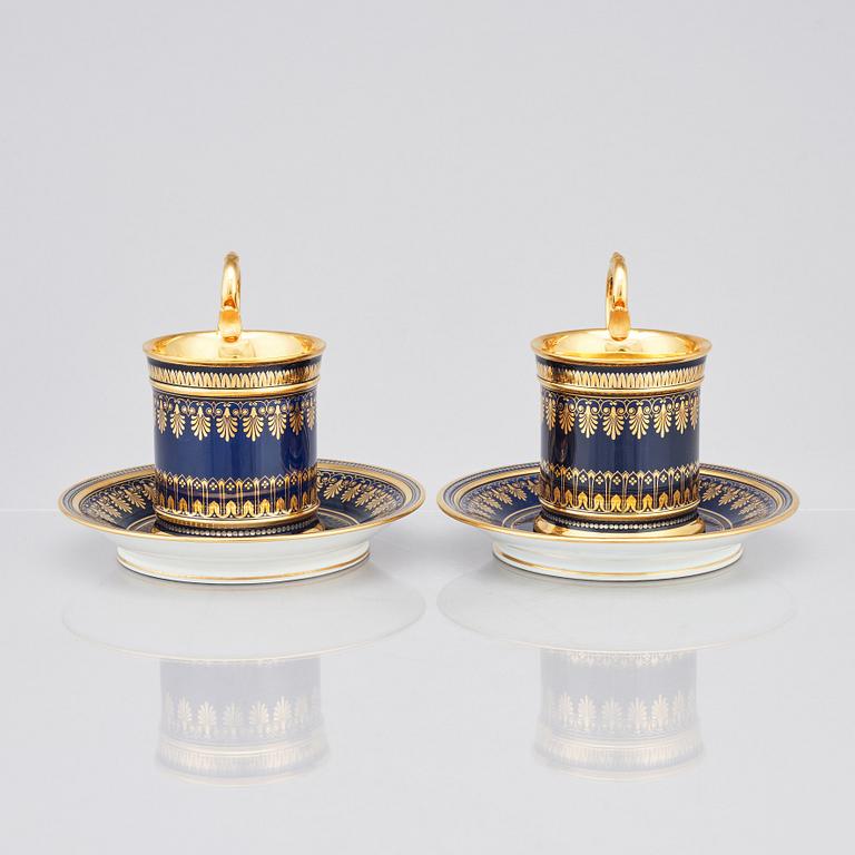 A pair of Sèvres cups with stands, 19th Century.