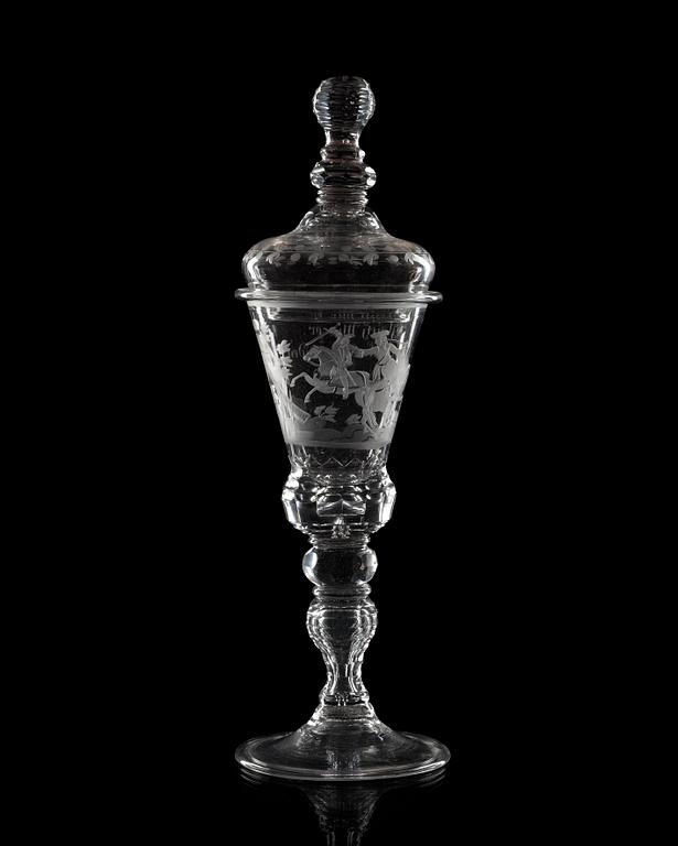A large German engraved and cut glass goblet and cover, 18th Century.