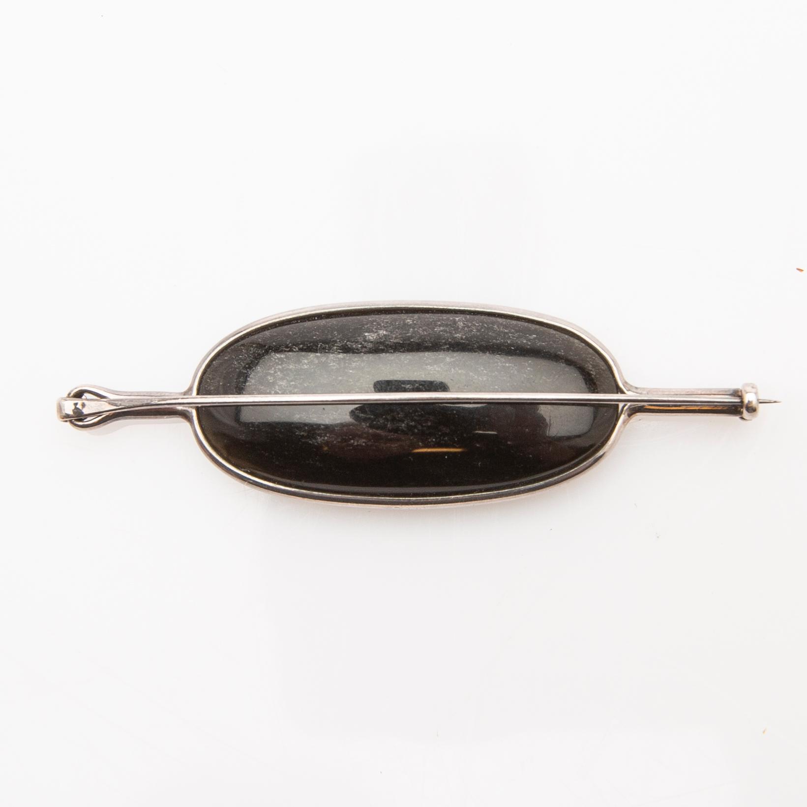 Vivianna Torun Bülow-Hübe, brooch, silver with mother-of-pearl and obsidian.