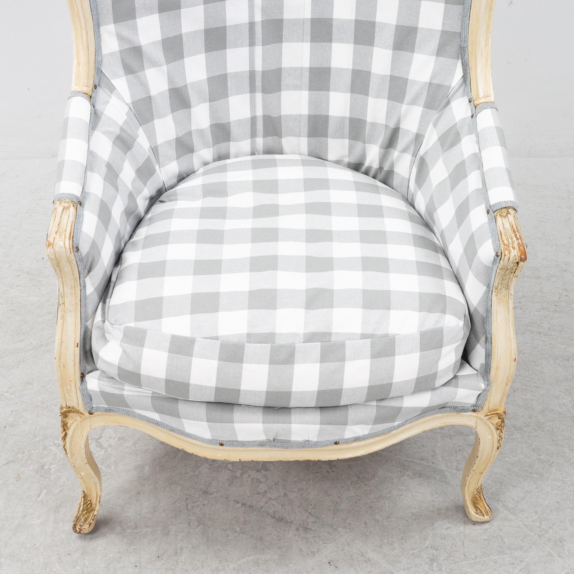 A Rococo-Style Bergère Easy Chair, first half of the 20th century.