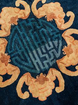 A carpet, a semi-antique Chinese,  ca 255 x 199-202,5 cm.