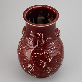 A red glazed Chinese vase, 20th century.