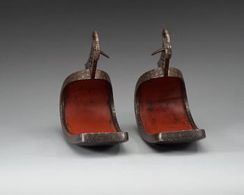 A pair of Japanese silvered bronze stirrups, Meiji (1868-1912).