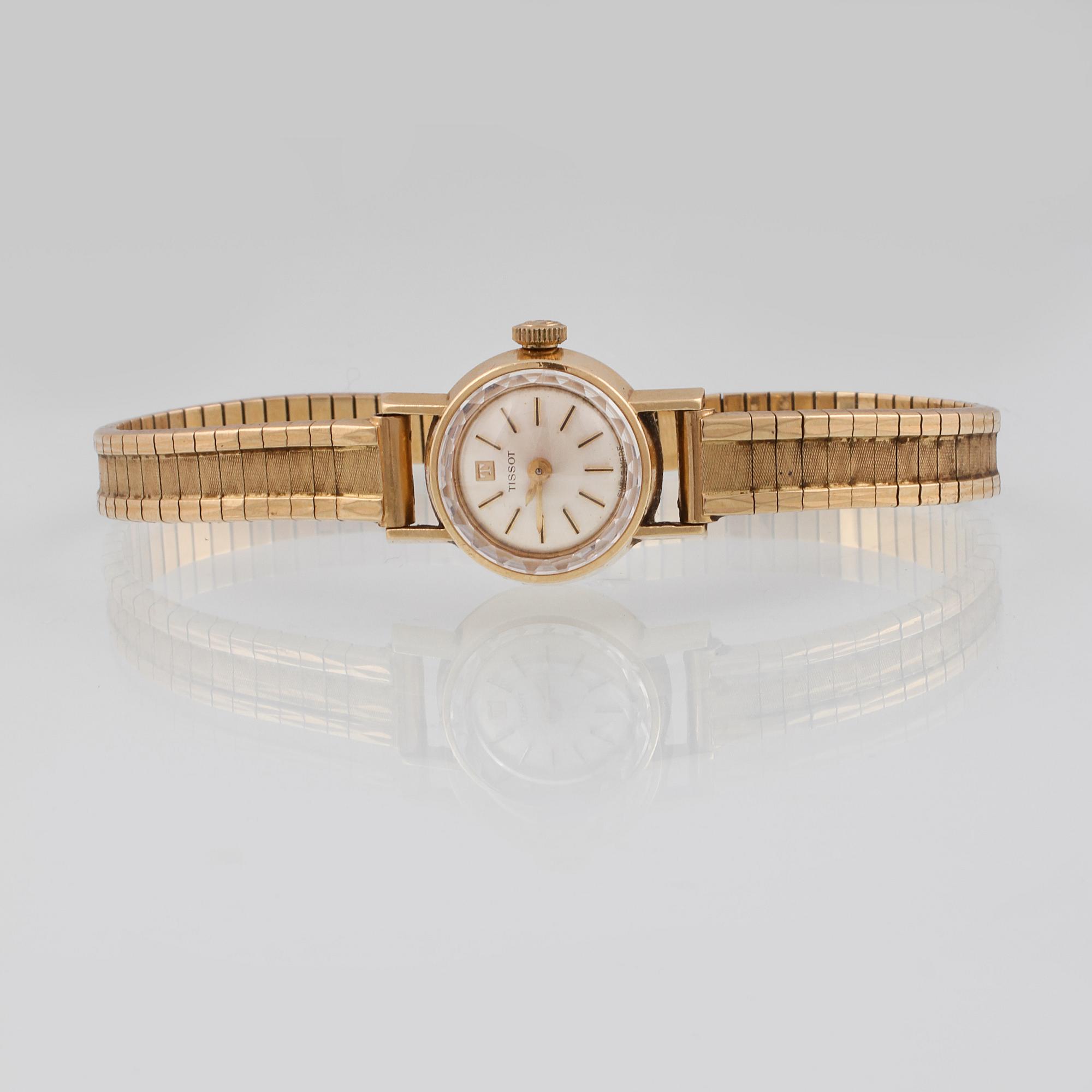 DAMARMBANDSUR, 18K guld, Tissot. Vikt 27,6 gram.