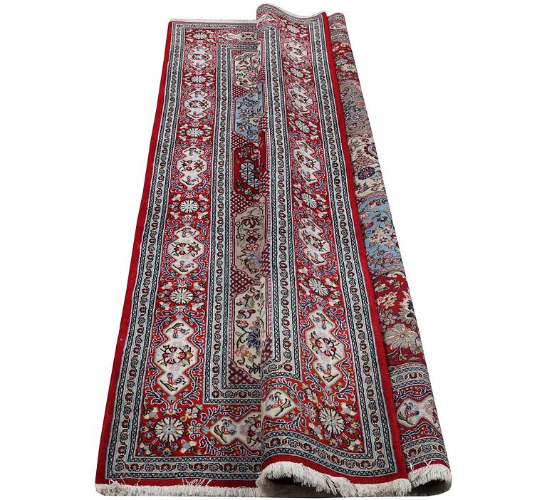 A Ghom rug, c. 250 x 150 cm.