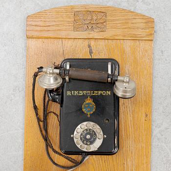 A wall mounted telphone, early 20th century.