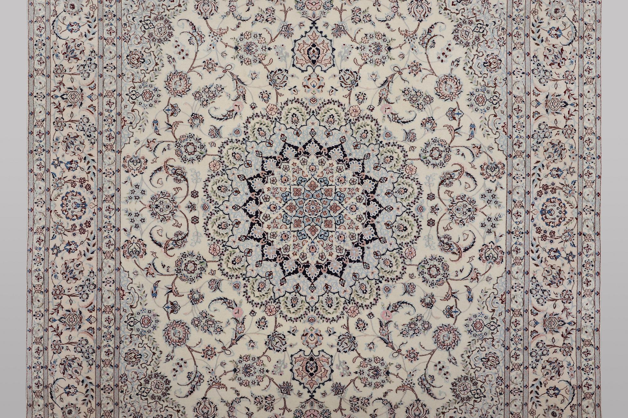 A carpet, Nain, part silk, ca 341 x 245 cm.