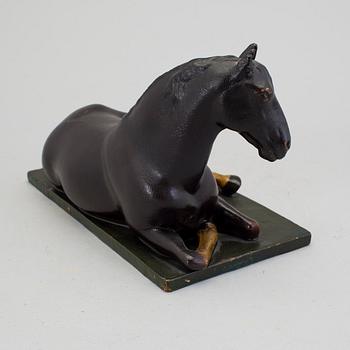 A papier mache horse signed and dated 1799.