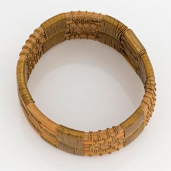 Vivianna Torun Bülow-Hübe, a rattan and brass bangle, executed in her own workshop, 1945-50's.