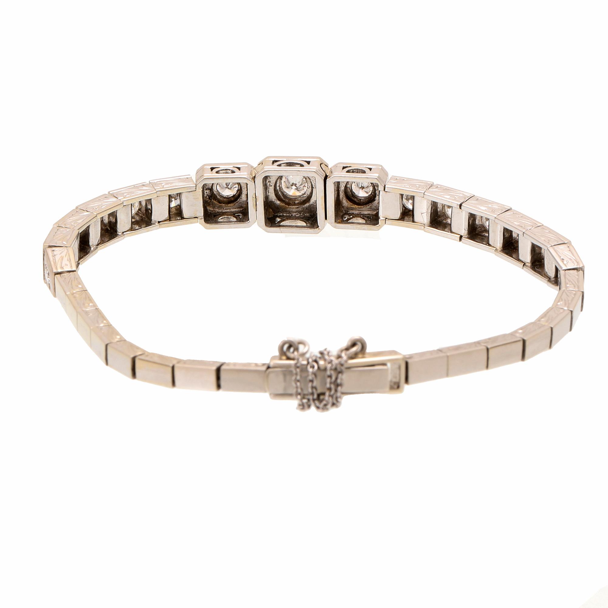 An 18K white gold bracelet with brilliant cut diamonds.