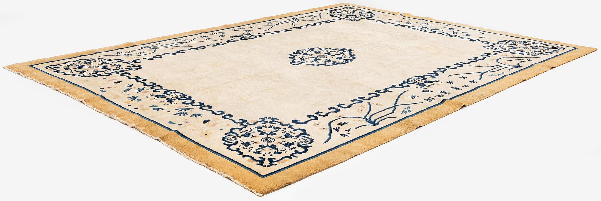 An antique Chinese carpet, 404 x 304 cm.