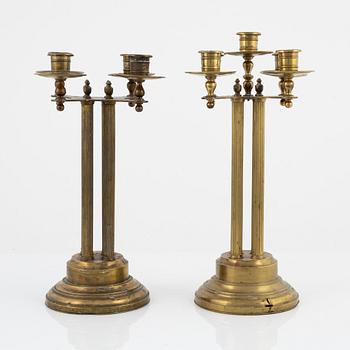 A pair of brass candelabras, first half of the 20th century.