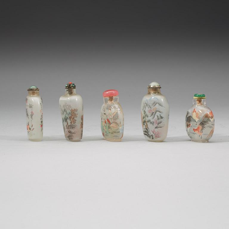 A group of five Chinese inside decorated snuff bottles with stoppers, early 20th Century.