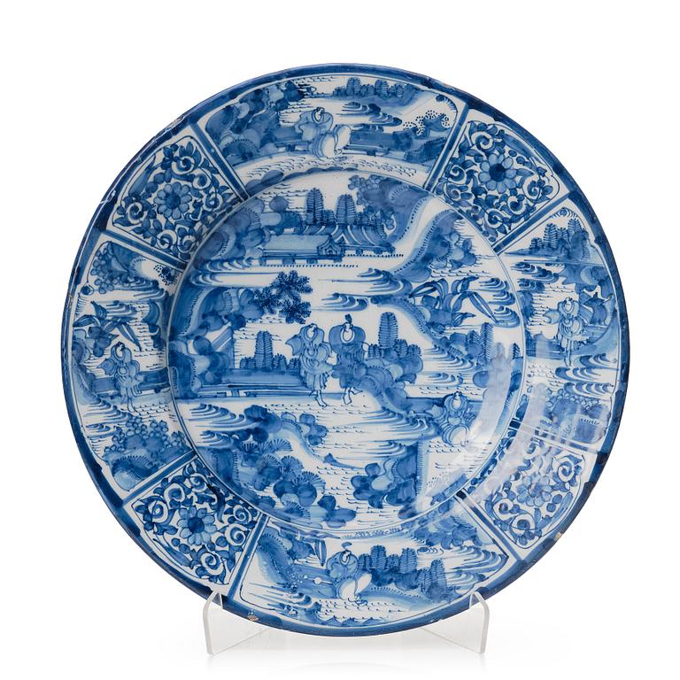 A large Dutch faience dish, second half of the 17th Century.