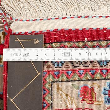 A Ghom rug, c. 160 x 105 cm.