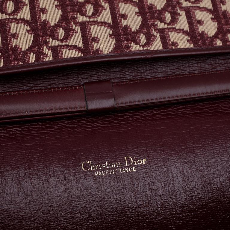 CHRISTIAN DIOR, a red monogram canvas shoulder bag.