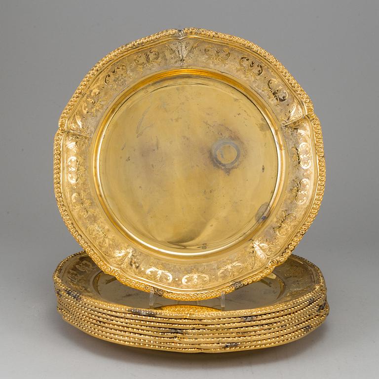 A set of nine silver-gilt sterling plates, Mexico 20th century. Rococo-style.