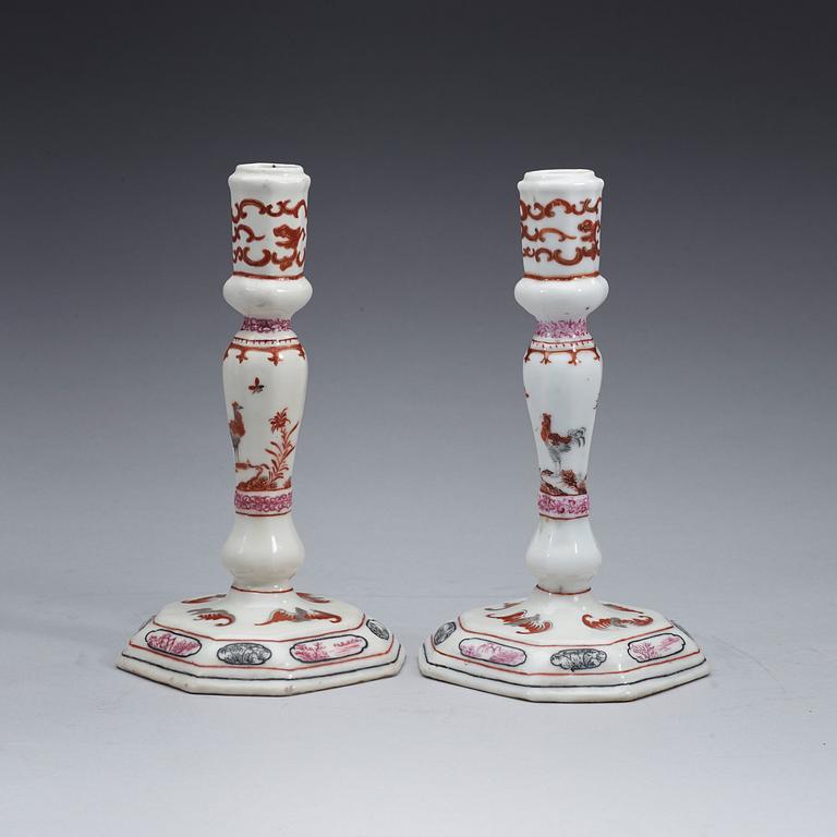 A pair of famille rose candle sticks, Qing dynasty, Qianlong (1736-95).