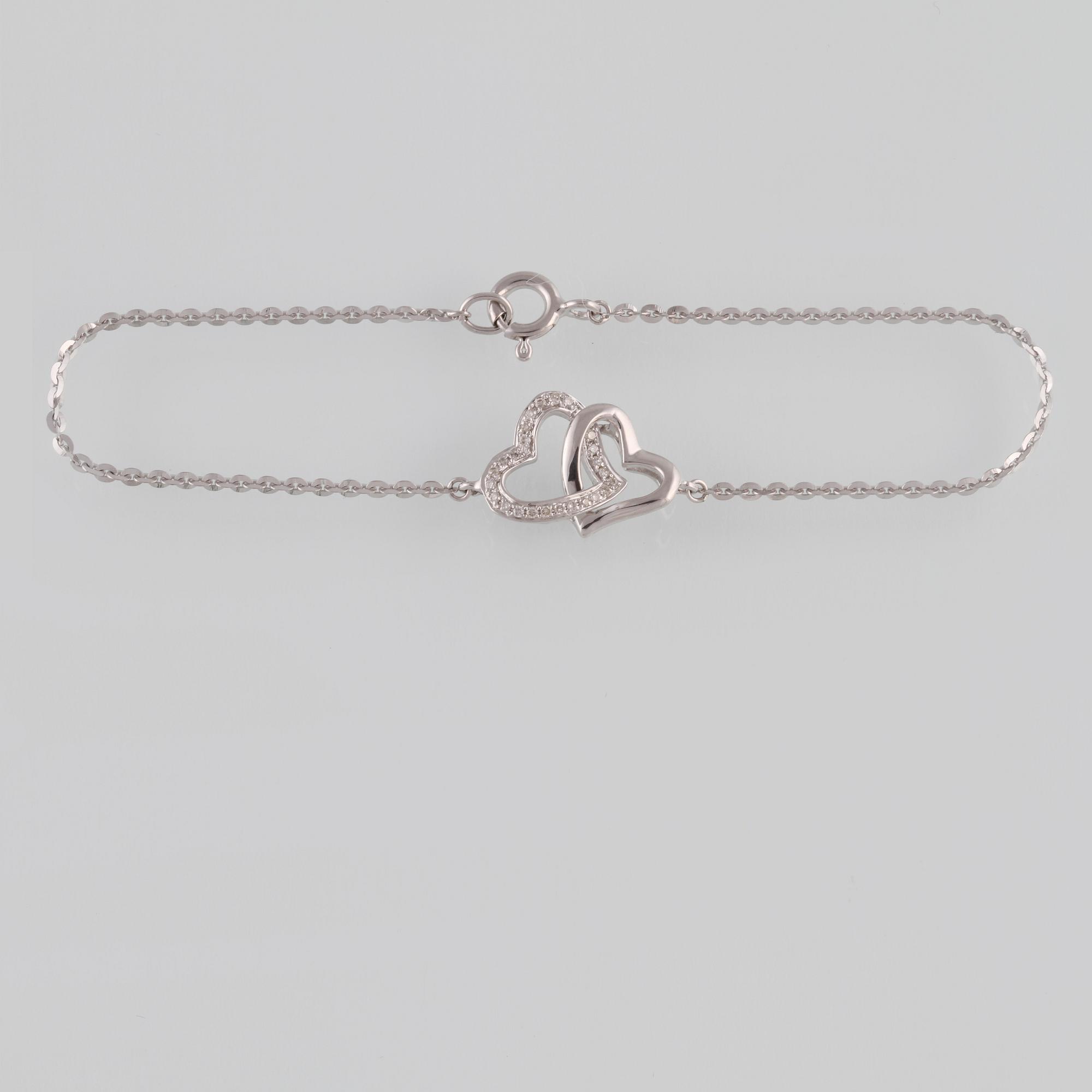 ARMBAND, 18K vitguld med briljantslipade diamanter ca 0.07 ct. Vikt 2,0 gram.